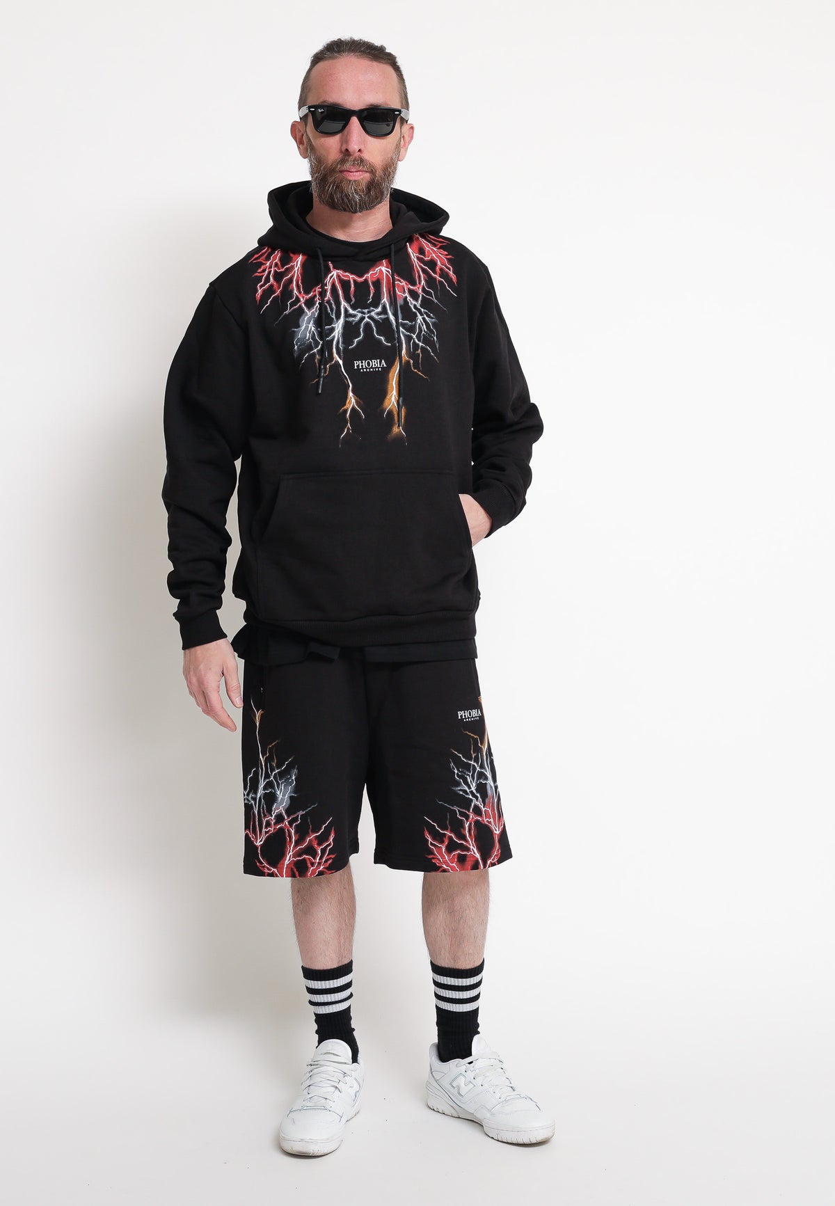 Black shorts with red, grey, and orange lightning. — 4